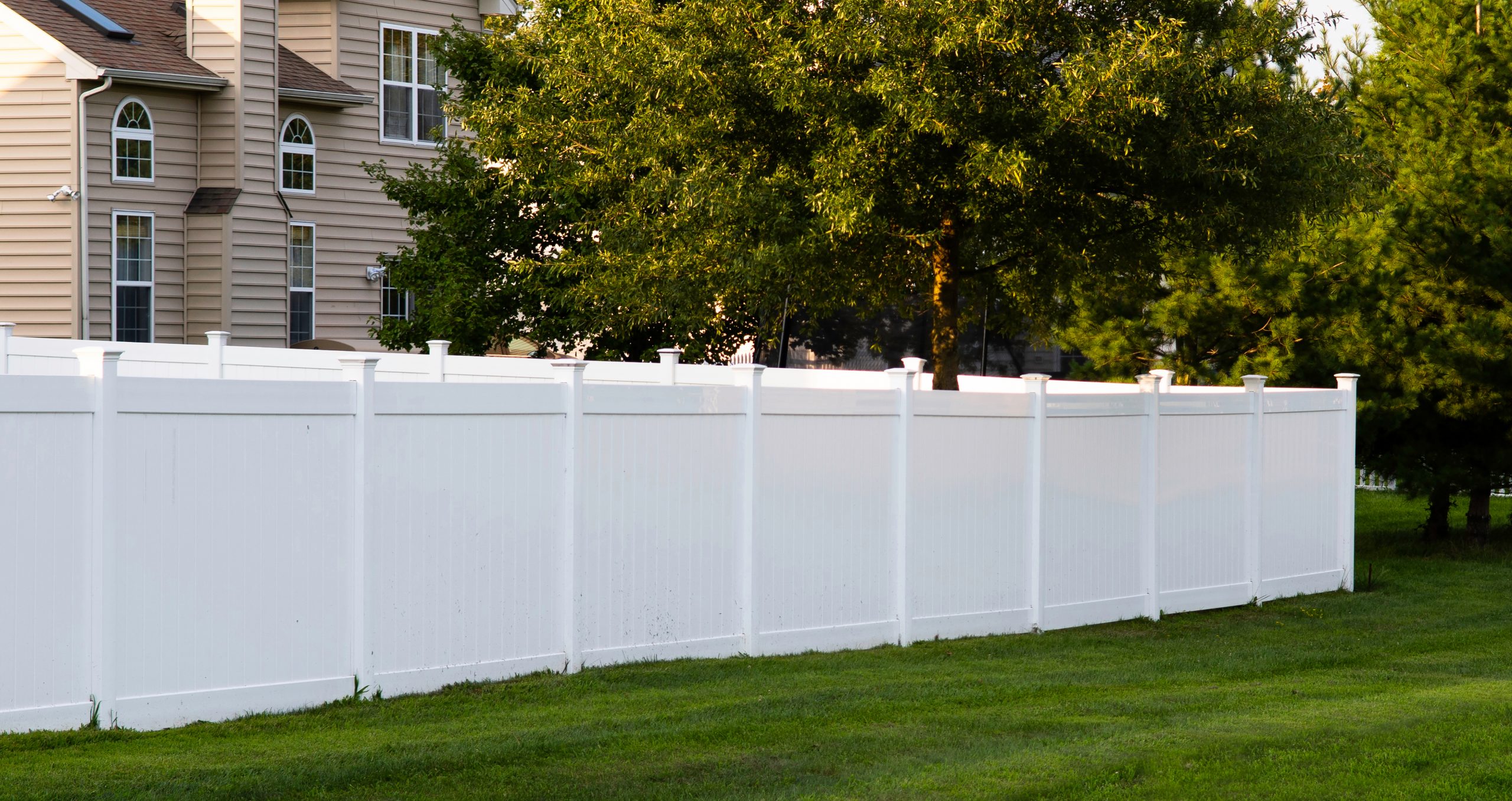Factory-Direct Vinyl Privacy Fence Makes Backyard A Private Retreat